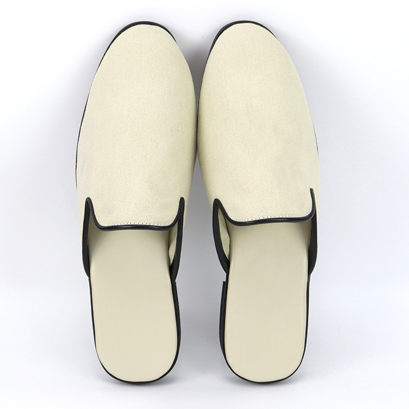 Top view of elegant custom cream mule slippers with contrasting black trim by JNP Footwear