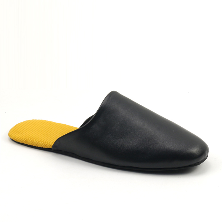 Side view of a black custom leather mule slipper with a contrasting yellow insole by JNP Footwear