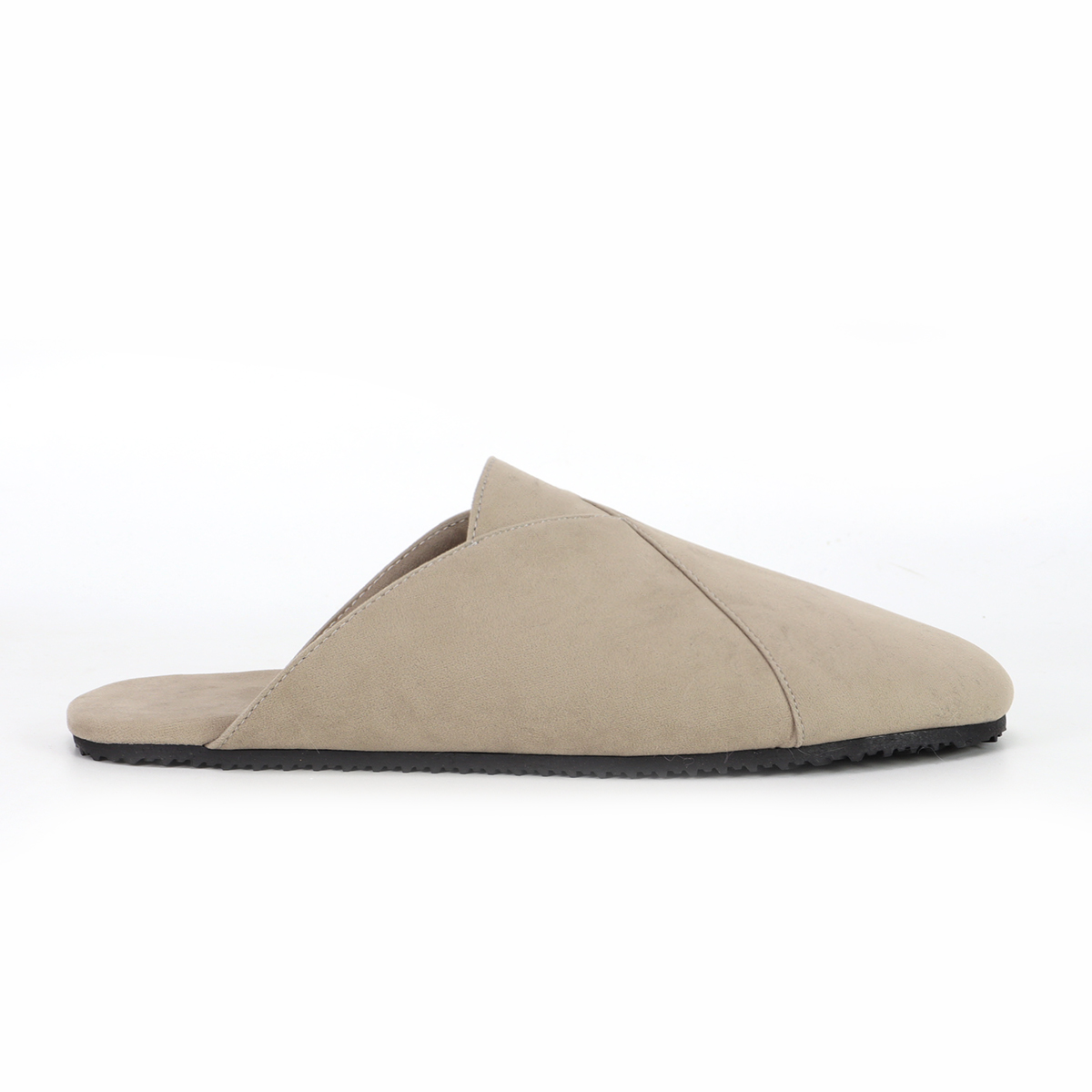 Side profile of a beige custom suede-like mule slipper by JNP Footwear, showcasing its sleek design