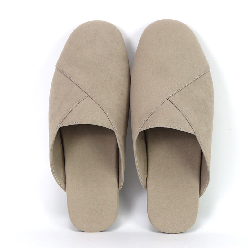 Top view of luxurious custom black velvet slippers by JNP Footwear with ornate gold embroidery and striking red soles