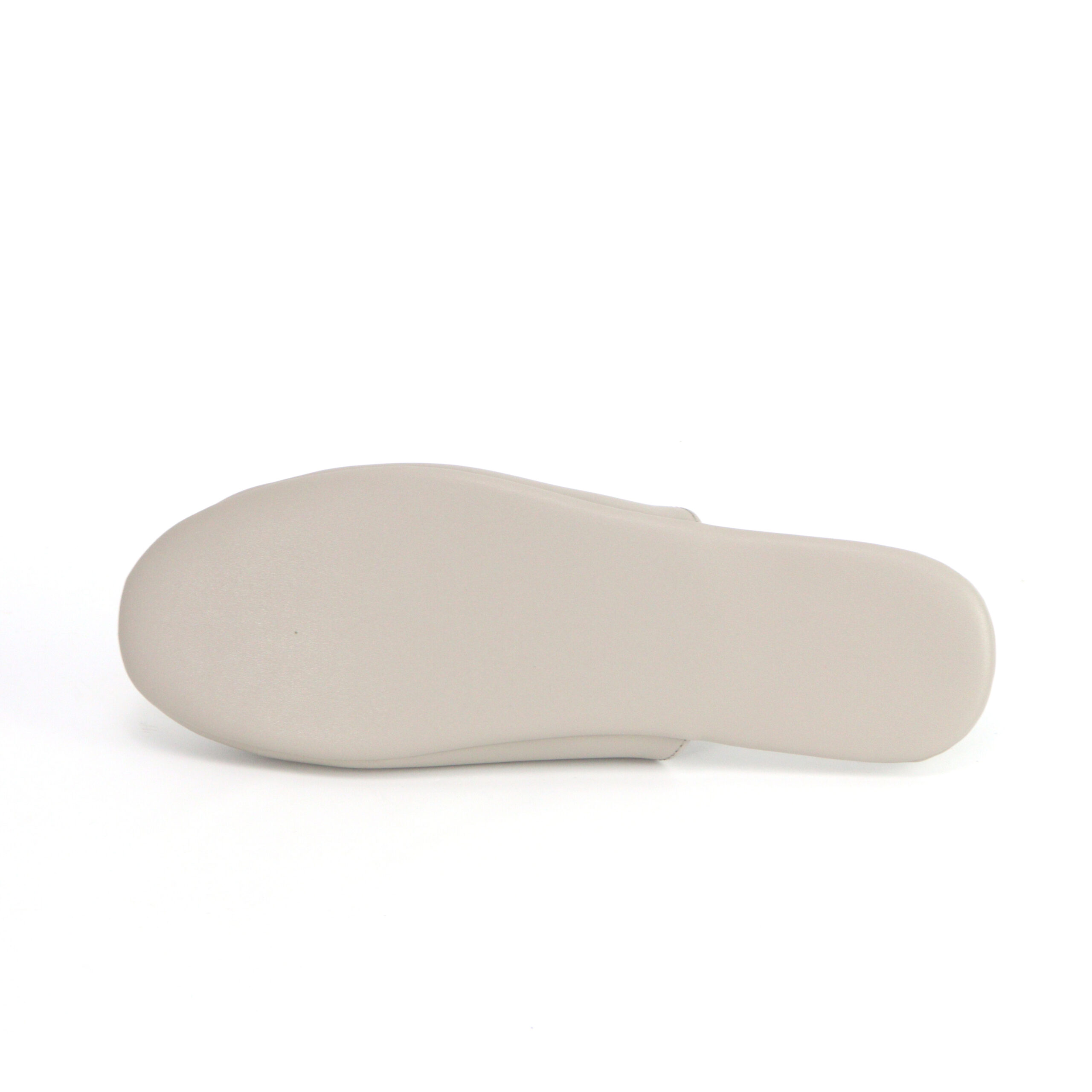 Bottom view of a smooth cream/white outsole for custom indoor slippers by JNP Footwear