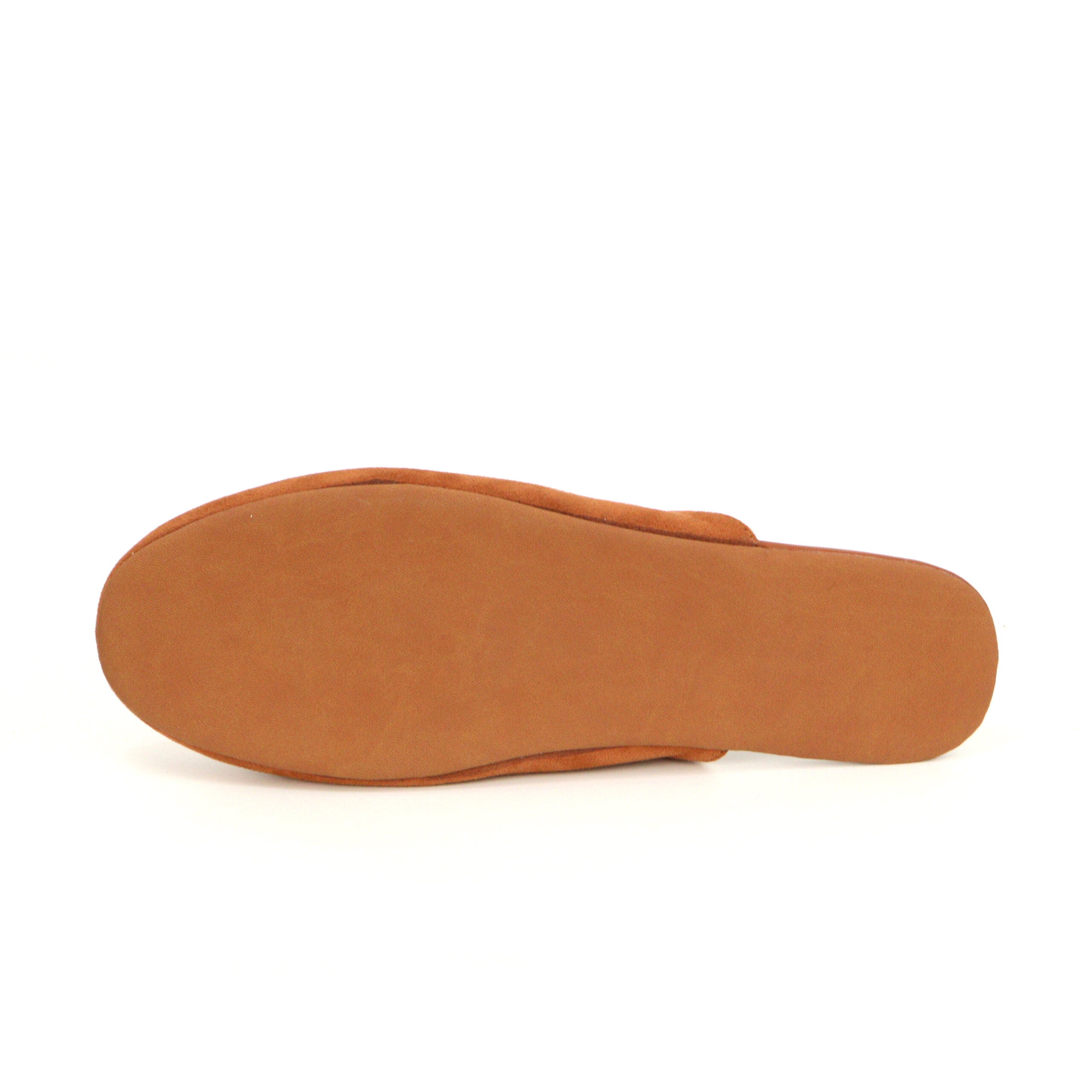 Bottom view of a tan patterned outsole for custom slippers, ensuring good grip, by JNP Footwear
