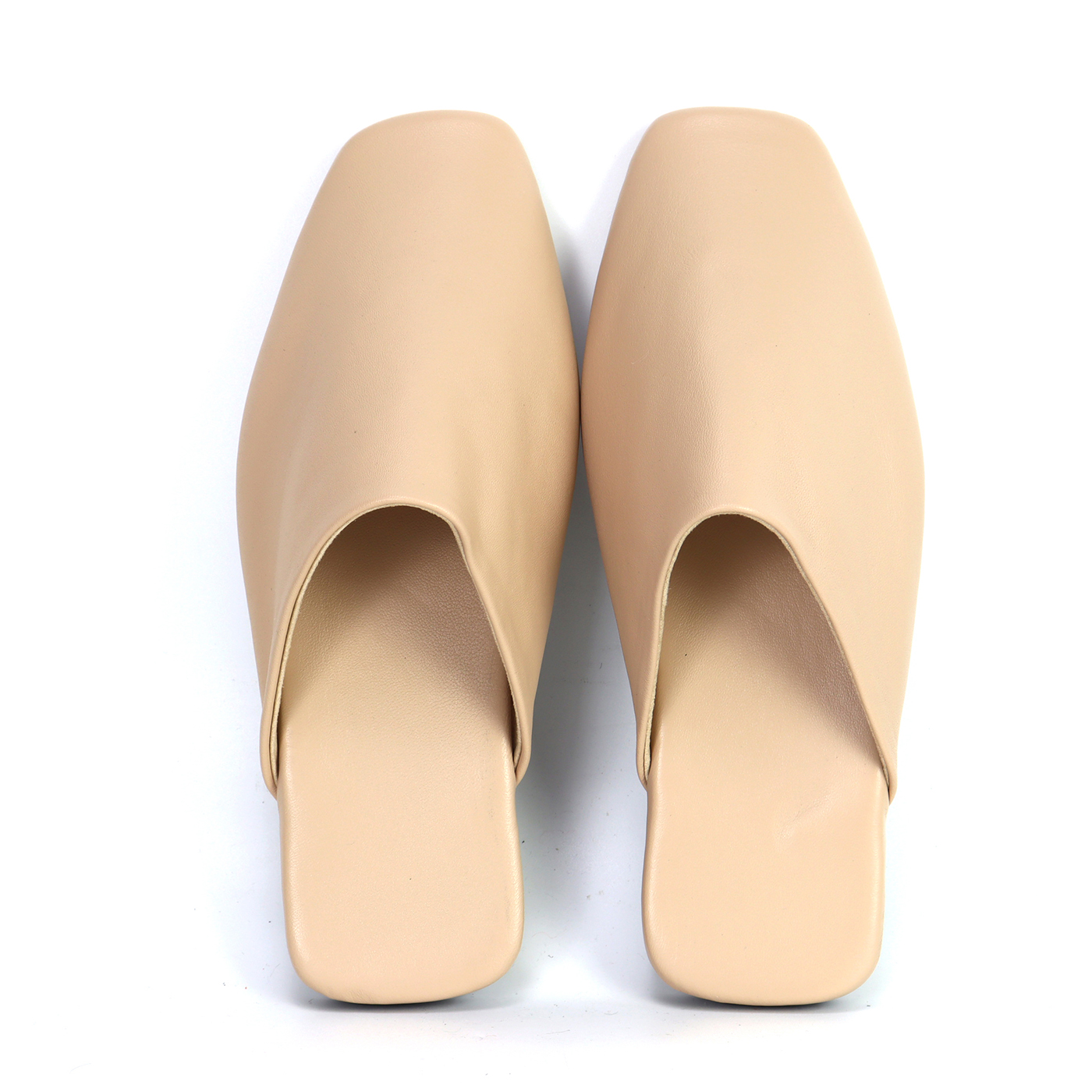 Top view of a pair of elegant beige nude custom leather-like mule slippers by JNP Footwear